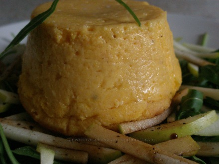 Carrot souffle on apple and rocket salad with balsamic vinegar